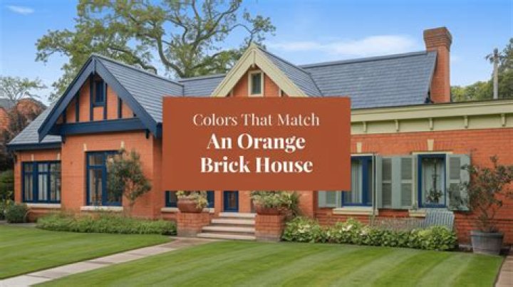 What color goes with orange brick house