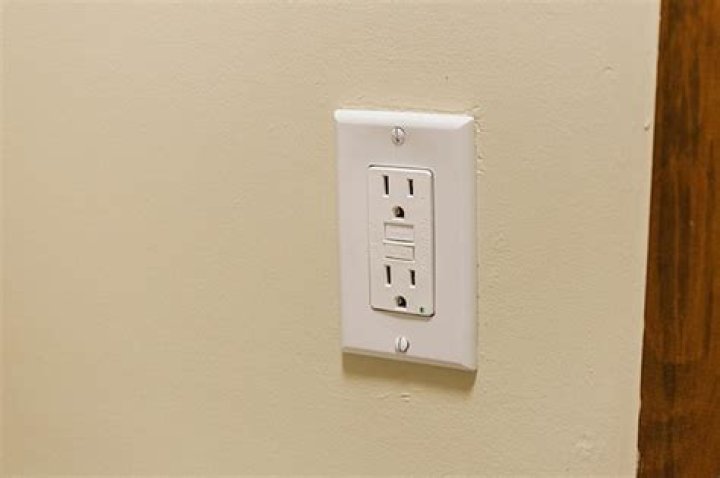 What is a tamper resistant electrical outlet