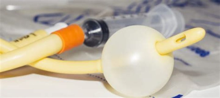 What is accomplished by inserting a tube through the urethra into the urinary bladder